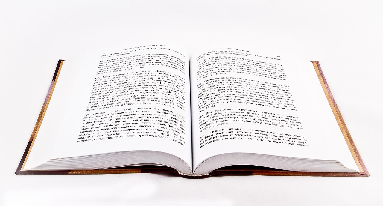 A large open book on a white background